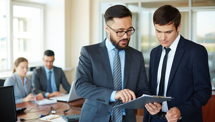 businessman-showing-changes-report