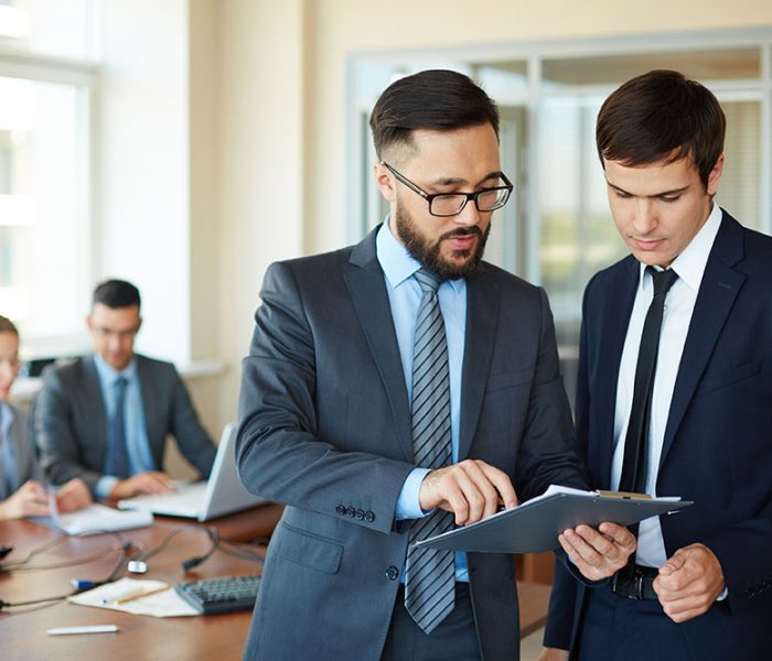 businessman-showing-changes-report